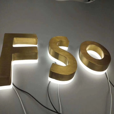 L'oro spazzola le lettere retroilluminate del metallo dei segni di acciaio inossidabile