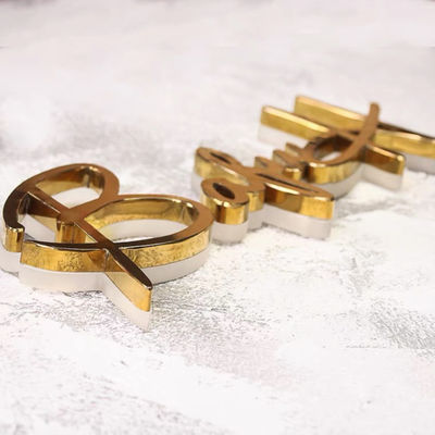 L'affare Logo Signage Stainless Steel Lighted dello specchio dell'oro immagazzina i segni anteriori